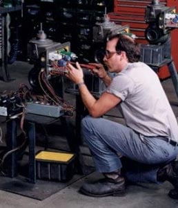 a man assembles a machine part