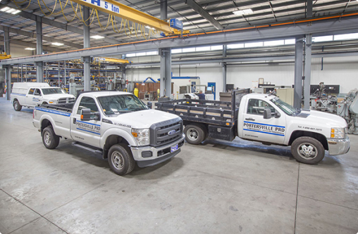 Portersville trucks parked in a warehouse